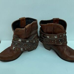 Corral mini booties in brown.
